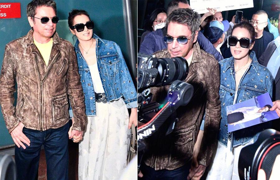 Vợ chồng Củng Lợi ở sân bay. Ảnh: Sina