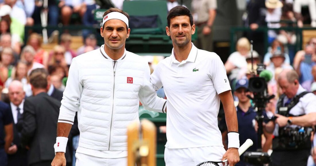 Federer (trái) và Djokovic trong trận chung kết Wimbledon 2019, nơi Djokovic thắng sau năm set. Ảnh: Reuters
