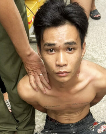 Lê Thành Dư lúc bị bắt giữ. Ảnh: Lê Đức