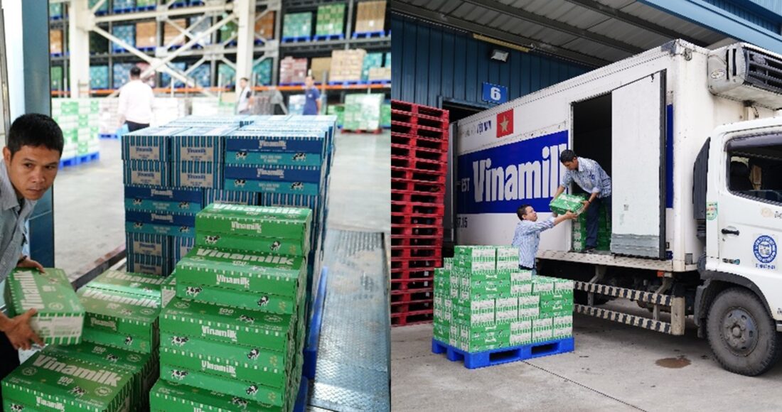 Nhân viên Vinamilk khẩn trương bốc xếp sữa tươi, nước uống chuyển lên xe đưa đến người dân, trẻ em vùng bão lũ. Ảnh: Vi Nam